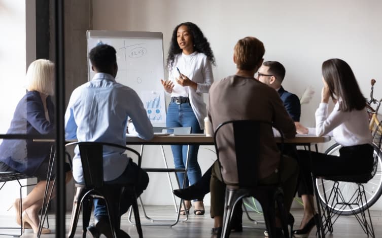 people watching presentation at a table