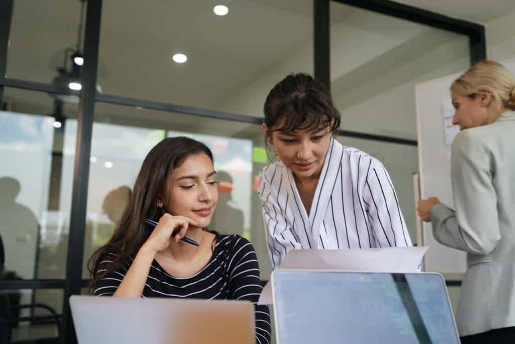 A group girl looking at computer screen