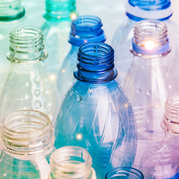 A group of plastic bottles on a table.