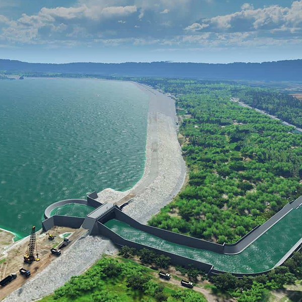 An aerial view of a dam near a body of water.