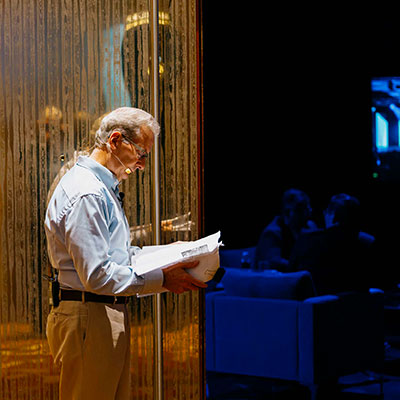 Greg Bentley reading a script on stage during the 2023 Year in Infrastructure and Going Digital Awards